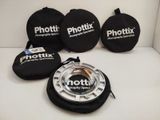 a picture of a phototix lens and other accessories on a white surface