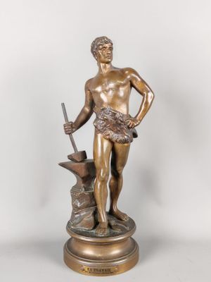 an antique bronze statue of a man with a sword and a hammer