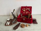 a red case filled with various tools on a table