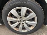 a close up of a tire on a white car