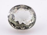 a close up of a white diamond on a white surface