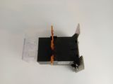 a close up of a black and orange switch on a white surface