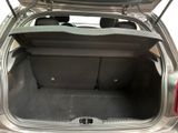 the back of a car with the trunk open and the seat folded down