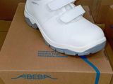 a box with a pair of white shoes on it