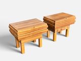 two small wooden tables with drawers on each side of them