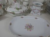 a table with a lot of plates and dishes on it