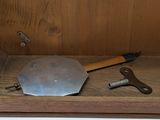 a wooden shelf with tools on top of it