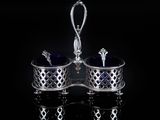 a pair of silver and blue glass salt and pepper shakers