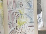 many drawings of a woman in a yellow dress on a table