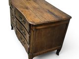 an old wooden chest of drawers with a drawer underneath it