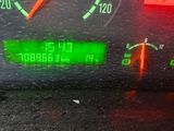 a close up of a car dashboard with a speedometer