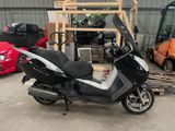 a scooter that is parked in a garage