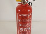 a red fire extinguisor sitting on a white surface