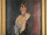 portrait of a woman in a blue dress in a gold frame