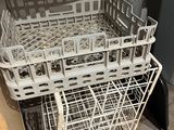 a pile of dirty dishes in a dishwasher