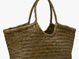 the large woven basket bag has a long handle and a long strap
