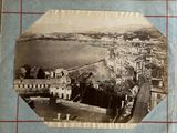 an old photo of a view of a city from the top of a building