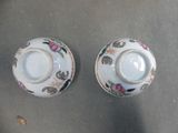 two cups that are sitting on a table