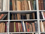 many books that are on the shelves in the room