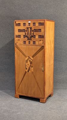 a wooden cabinet with a flower design on it