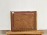 a picture of a painting on a wooden table