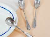 a plate with spoons and a plate with spoons and spoons on it