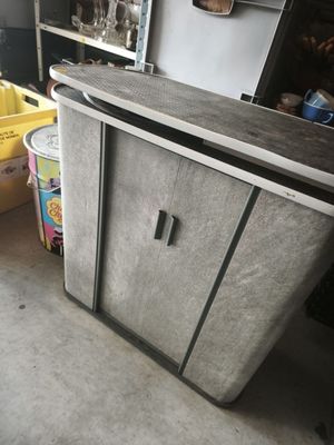 a kitchen with a counter and a refrigerator in it