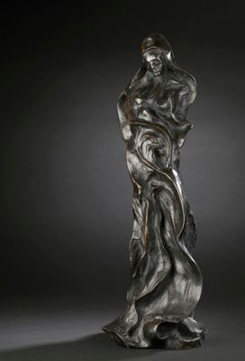 a bronze statue of a woman holding a child