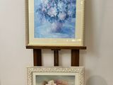 two pictures of flowers on a table next to a cross