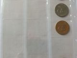 four different types of coins in a plastic bag