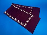 a close up of three pieces of cloth on a blue background