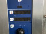 an image of a blue machine with buttons on it