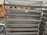 a pile of metal shelves in a warehouse with boxes and boxes