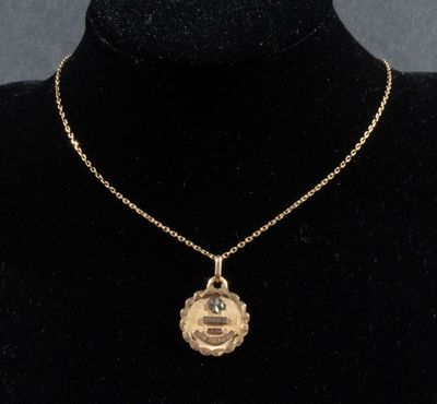 Ensemble en or 750/°°° comprenant une médaille d'amour Augis…