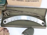 a measuring tool in a box next to a pair of shoes