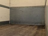 a empty room with a skateboard in the middle of it
