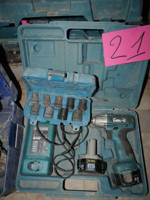 a blue case with tools in it on the floor