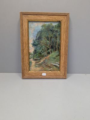 une image représentant un tableau d'un sentier dans les bois