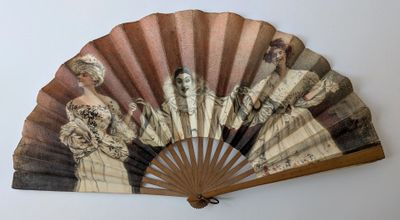 un ventilateur avec un tableau accroché au mur