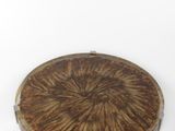 wooden tray with a circular design on it on a white surface
