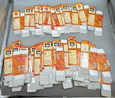 a lot of orange and white cards in a box