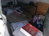 a white van with a bunch of boxes in the back of it