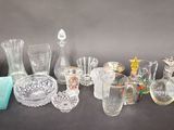 a lot of glass items sitting on a table