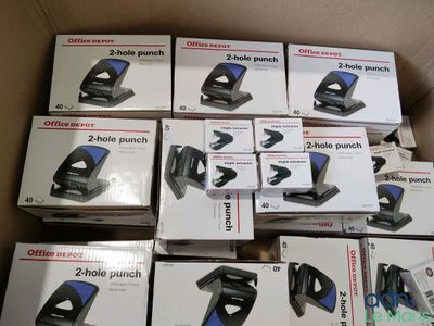 boxes of office staplers are stacked on top of each other