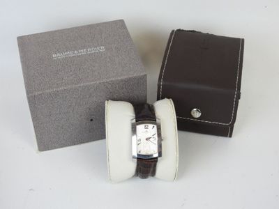 a watch that is sitting in a box on the table
