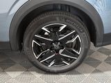 a close up view of a car ' s wheel on the ground