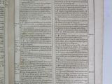 an open book with a page in it sitting on top of a table