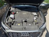 a car with its hood open and the engine in the trunk
