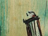 a painting of a rocking chair with a bird on it