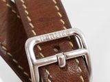 a close up of a person ' s hand holding a watch